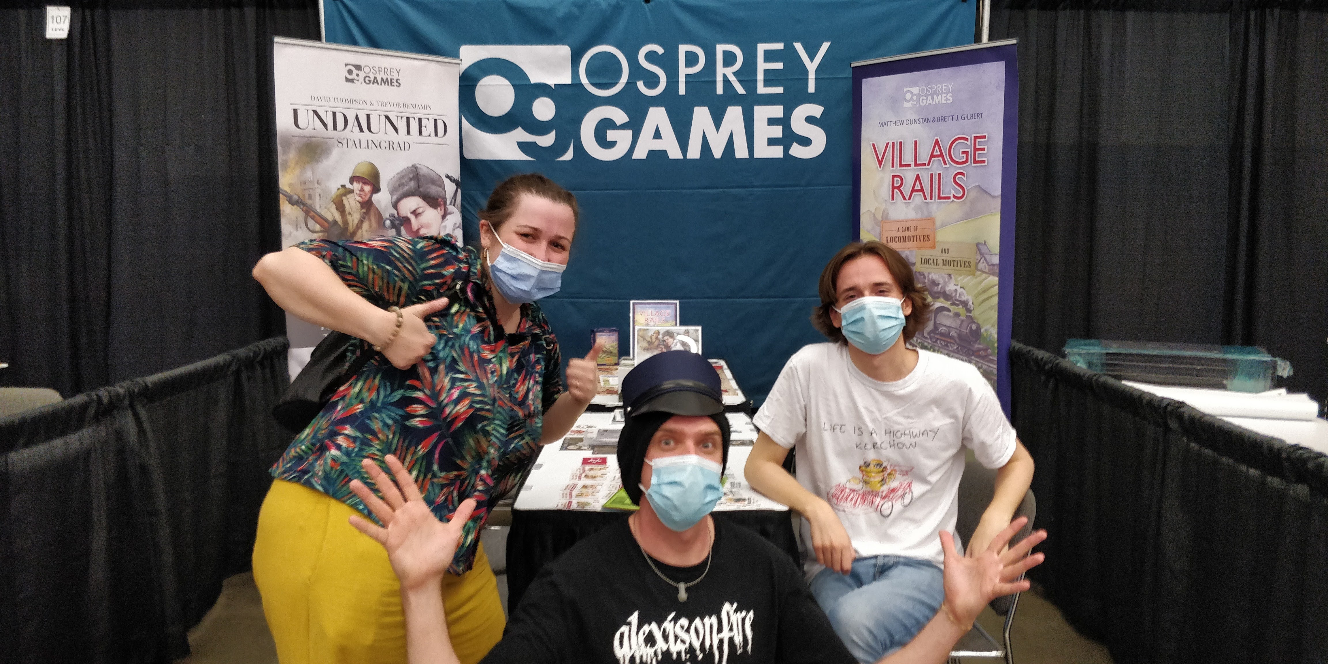 A photo of the Osprey Games team in front of our fully set-up stand at SHUX 2022