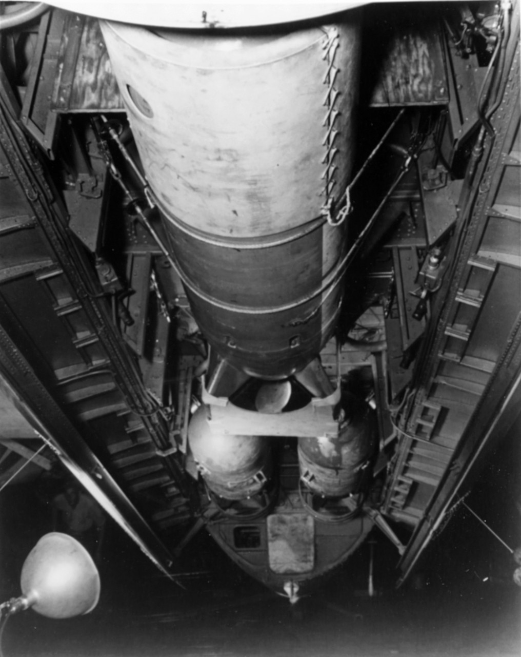 02 The Mark 24 homing torpedo (or Fido) in the bomb bay of an Aveger. Behind it are two depth charges. (USNHHC)