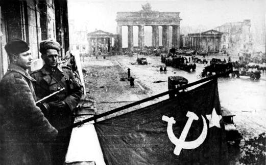 Russian soldiers hoist their red flag in Berlin on the 2nd of May.