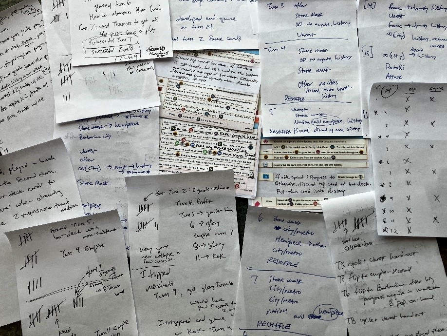 A photo of a pin board covered in densely written design notes